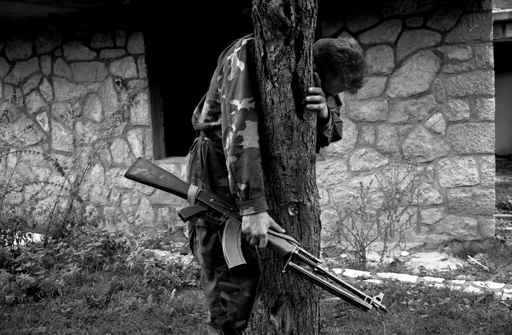 @1995 Emmanuel Ortiz.
A Bosniak soldier cries after arriving to his home village, 3 years early he had hid in the forest and watched his family and the rest of the village executed by Bosnian Serb forces.